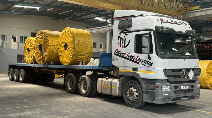 A Freight Trans Logistics Mercedes-Benz Actros 2646 hauling a flatbed trailer loaded with industrial cable reels