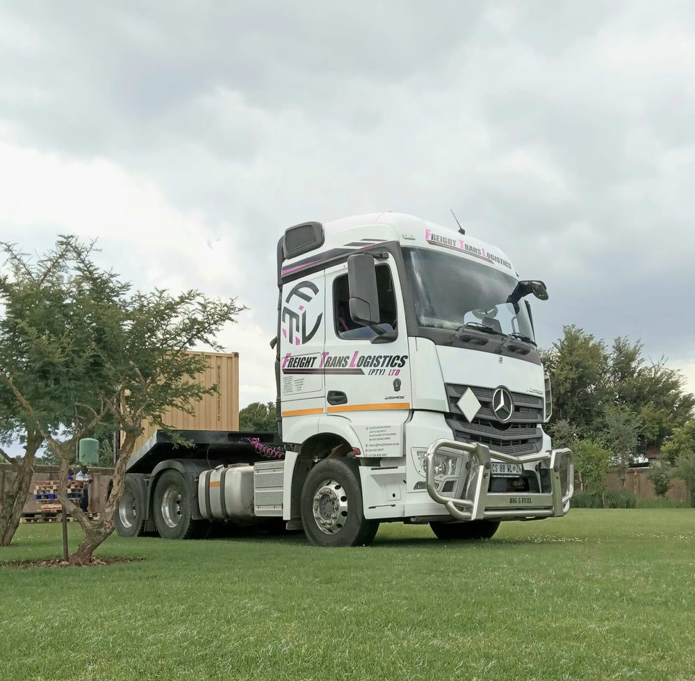 A Freight Trans Logistics Mercedes-Benz Actros truck tractor with a shipping container behind it